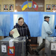 A woman casts her ballot during the Crimean referendum, in Sevastopol, Ukraine, on March 16.